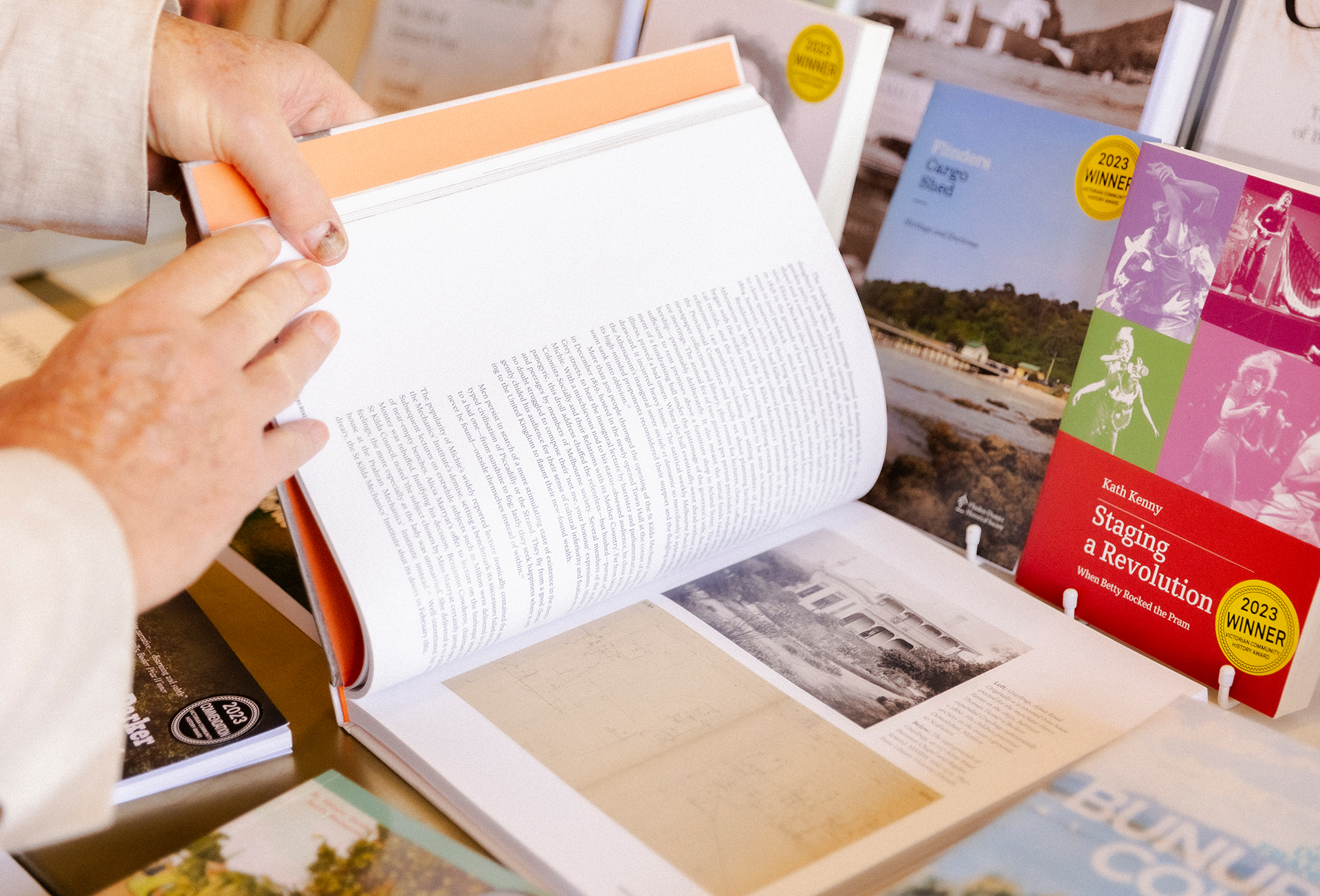 hands flipping through books