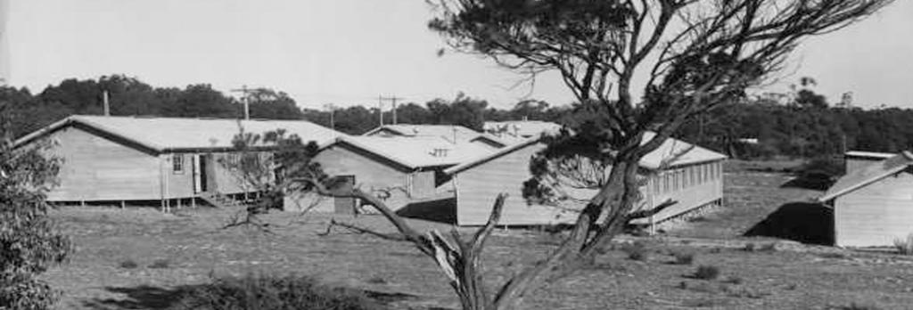 Rowville camp buildings, from the Argus newspaper collection of war photographs, World War II, originally captioned ‘Rosehill (Dandenong) camp, these huts at present empty’, c. 1945, State Library Victoria, Pictures Collection, H99.201/410