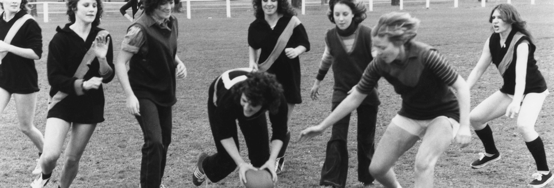 women playing football